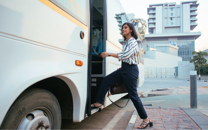 A woman boarding a Cityflo bus from Thane to her office in BKC.