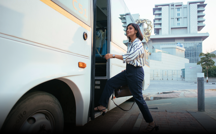 A woman boarding a Cityflo bus from Thane to her office in BKC.