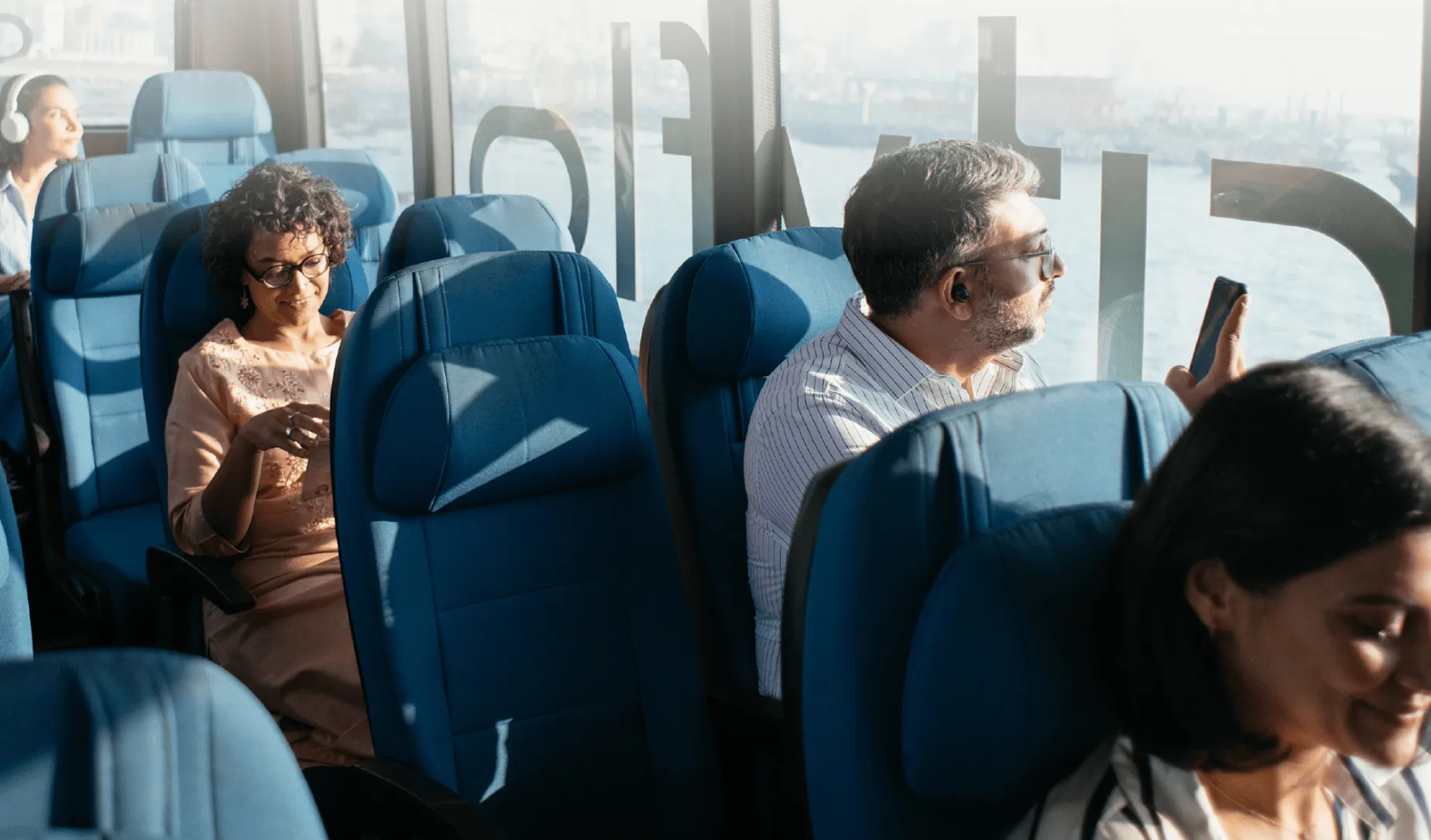 Employees seated on a Cityflo bus